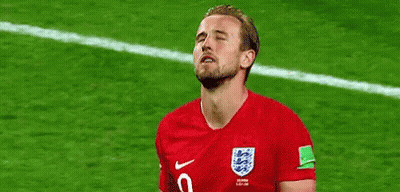 A Soccer Player Is Standing On A Field With His Eyes Closed And His Mouth Open . GIF