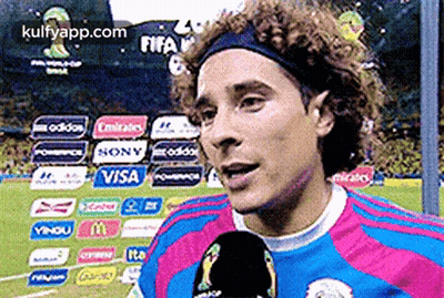 A Soccer Player Is Talking Into A Microphone While Wearing A Headband Sponsored By Visa GIF