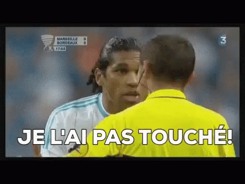 A Soccer Player Is Talking To A Referee Who Is Wearing A Yellow Shirt That Says Je L' Ai Pas Touche ! GIF