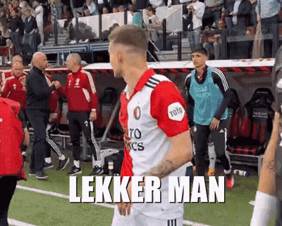 A Soccer Player Is Walking On The Field With The Words Lekker Man Written On The Bottom GIF