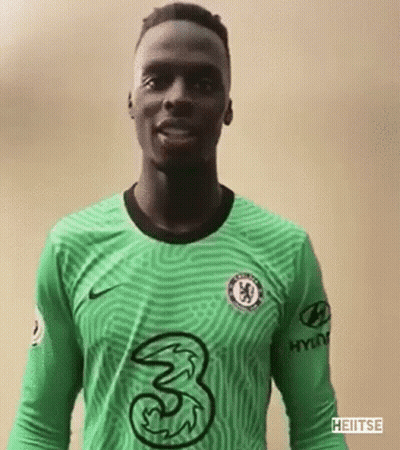 A Soccer Player Is Wearing A Green Jersey With A 3 On It . GIF