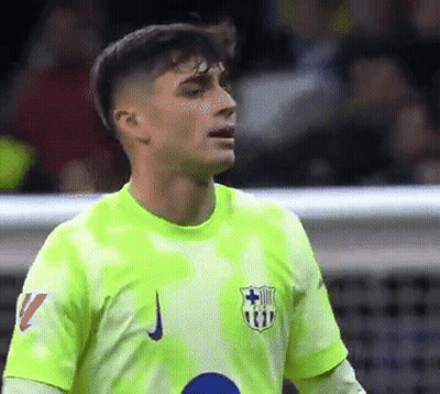 A Soccer Player Is Wearing A Neon Green Shirt With The Number 11 On It GIF