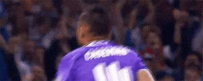 A Soccer Player Is Wearing A Purple Jersey With The Number 11 On It . GIF