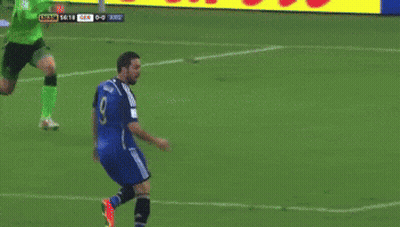 A Soccer Player Jumps To Catch A Ball In Front Of An Advertisement For Lib GIF