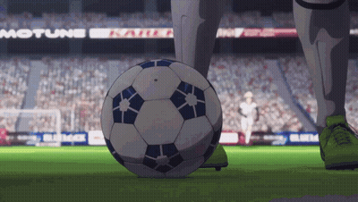 A Soccer Player Kicks A Soccer Ball On A Field With A Motune Sign In The Background GIF