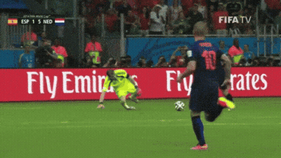 A Soccer Player Kicks The Ball In Front Of A Fly Emirates Advertisement GIF