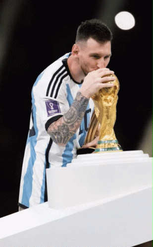A Soccer Player Kisses A Trophy With The Number 8 On It GIF