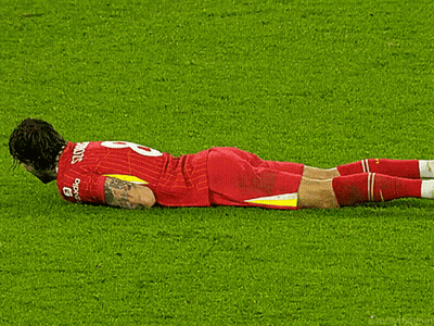A Soccer Player Laying On The Field With The Number 8 On His Jersey GIF