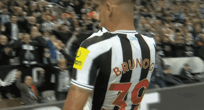A Soccer Player Named Bruno Is Wearing A Black And White Striped Jersey GIF