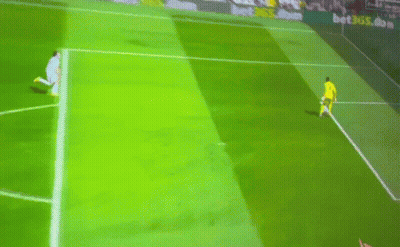 A Soccer Player Runs Towards A Goal With A Banner Behind Him That Says Betsson.com GIF