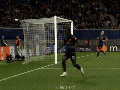 A Soccer Player Runs Towards A Goal With A Watermark That Says X-Mciihfc GIF