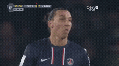 A Soccer Player Stands In Front Of A Bein Sports Screen GIF