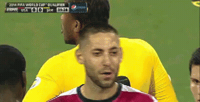 A Soccer Player Stands In Front Of A Scoreboard That Says Fifa World Cup Qualifier On It GIF