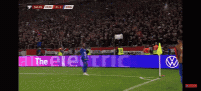 A Soccer Player Stands In Front Of A Sign That Says " All The Electric " GIF