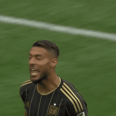 A Soccer Player Wearing A Black And Gold Jersey That Says Lmt On It GIF