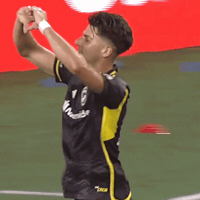 A Soccer Player Wearing A Black And Yellow Jersey That Says Oakland On It GIF