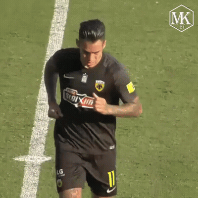 a soccer player wearing a black jersey with the number 11 on it