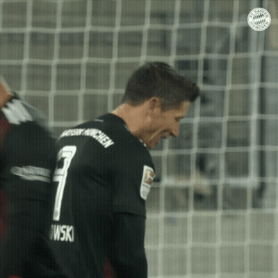 A Soccer Player Wearing A Black Jersey With The Number 7 On The Back GIF