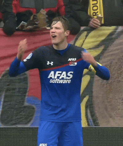 A Soccer Player Wearing A Blue Afas Software Jersey Holds His Hands To His Head GIF