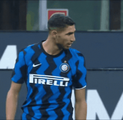 A Soccer Player Wearing A Blue And Black Shirt With The Word Irelli On The Front GIF