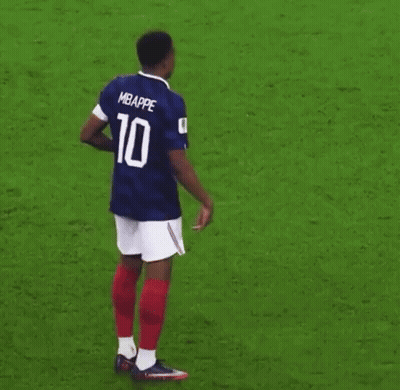 A Soccer Player Wearing A Blue And White Jersey With The Number 10 On It Is Standing On A Soccer Field . GIF