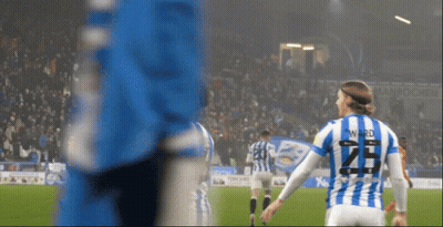 A Soccer Player Wearing A Blue And White Striped Jersey With The Number 25 On The Back GIF