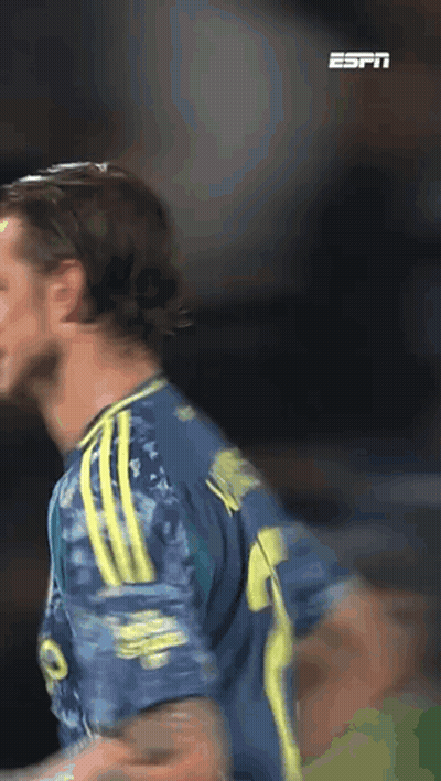 A Soccer Player Wearing A Blue And Yellow Jersey With The Number 9 On It GIF