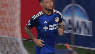 A Soccer Player Wearing A Blue Jersey That Says Merci Health On It GIF