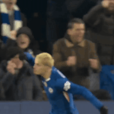 A Soccer Player Wearing A Blue Jersey With The Number 10 On The Front GIF