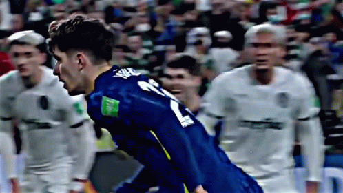 A Soccer Player Wearing A Blue Jersey With The Number 21 On The Back GIF