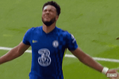 A Soccer Player Wearing A Blue Jersey With The Number 3 On It Is Celebrating On The Field . GIF