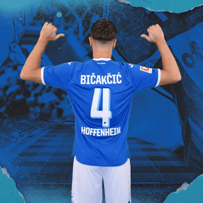 A Soccer Player Wearing A Blue Jersey With The Number 4 On It GIF