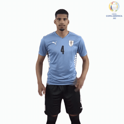 a soccer player wearing a blue number 4 jersey
