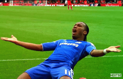 A Soccer Player Wearing A Blue Samsung Jersey With His Arms Outstretched On The Field GIF