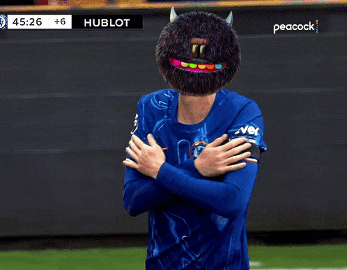 A Soccer Player Wearing A Blue Shirt With A Peacock Logo On The Bottom GIF