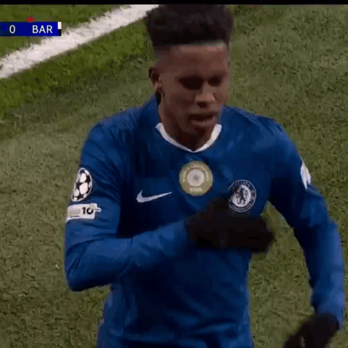 A Soccer Player Wearing A Blue Shirt With The Number 10 On It Is Standing On A Field . GIF