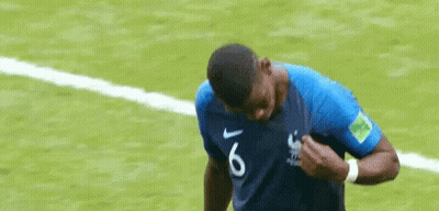 A Soccer Player Wearing A Blue Shirt With The Number 6 On It Is Standing On A Soccer Field . GIF