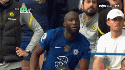 A Soccer Player Wearing A Chelsea Jersey Is Sitting In The Stands During A Game . GIF