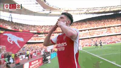 A Soccer Player Wearing A Emirates Jersey Celebrates A Goal GIF