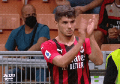 A Soccer Player Wearing A Fly Emirates Jersey Applauds The Crowd GIF