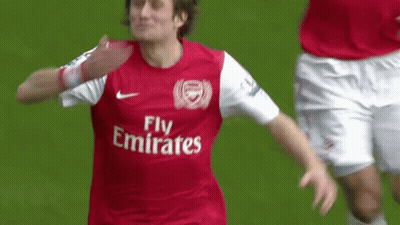 A Soccer Player Wearing A Fly Emirates Jersey Celebrates A Goal GIF