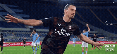 A Soccer Player Wearing A Fly Emirates Jersey Celebrates His Goal GIF