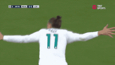 A Soccer Player Wearing A Fly Emirates Jersey Is Celebrating GIF