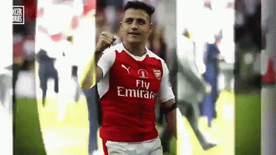 A Soccer Player Wearing A Fly Emirates Jersey Is Celebrating A Goal On The Field . GIF