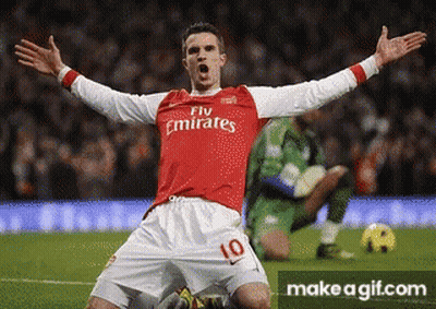 A Soccer Player Wearing A Fly Emirates Jersey Is Celebrating GIF