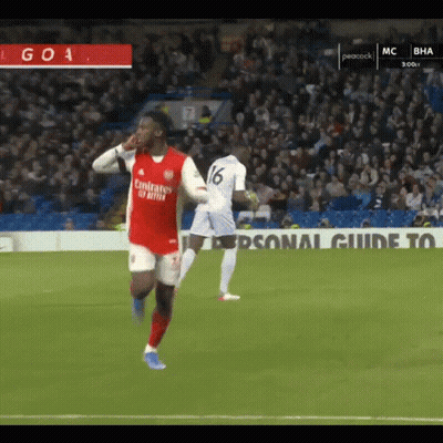 A Soccer Player Wearing A Fly Emirates Jersey Is Running On The Field GIF
