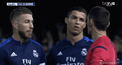A Soccer Player Wearing A Fly Emirates Jersey Is Talking To Another Player GIF