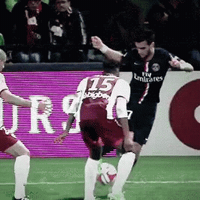 A Soccer Player Wearing A Fly Emirates Jersey Kicks The Ball GIF