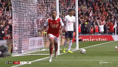 A Soccer Player Wearing A Fly Emirates Shirt Is Running Towards The Goal GIF