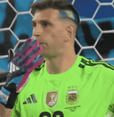 A Soccer Player Wearing A Green Adidas Jersey With The Number 20 On It GIF